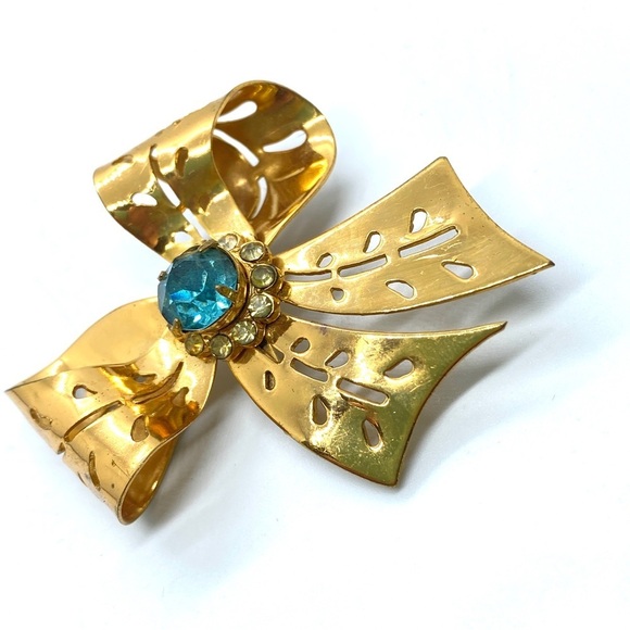 Vintage Goldtone Blue Rhinestone Bow Cut Out Brooch - Picture 2 of 7